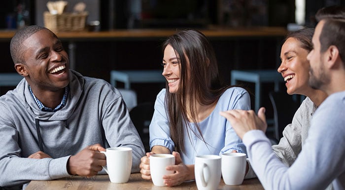 a group of friends together in a coffee shop