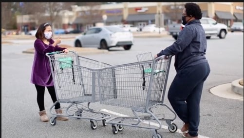 People social distancing at the grocery store