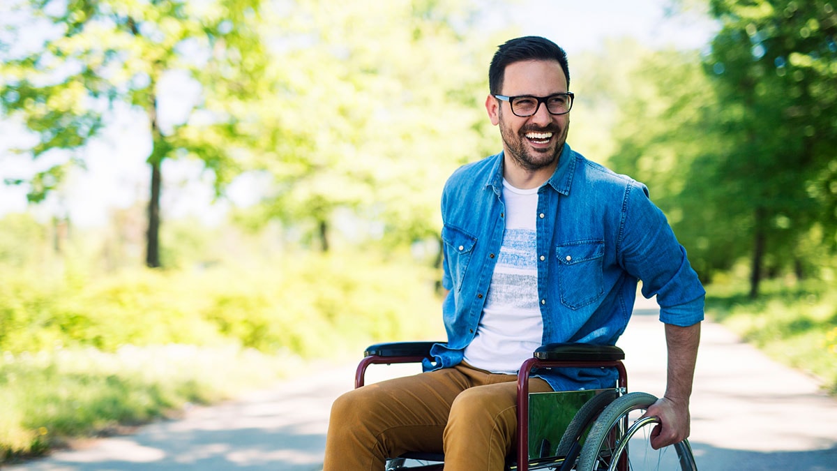 A man in a wheelchair at the park