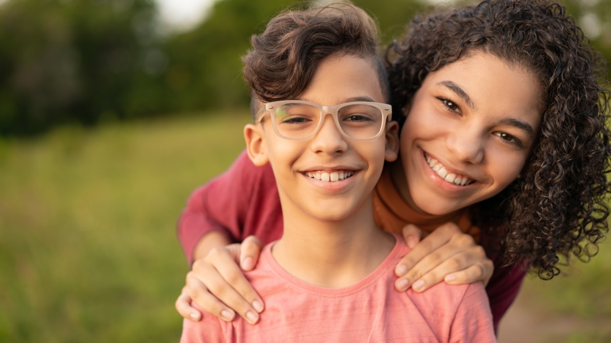 mother and son with wide smiles