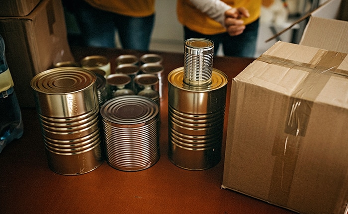 table of canned foods with no labels.