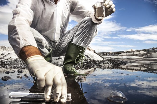 A scientist analyzes the water of a river