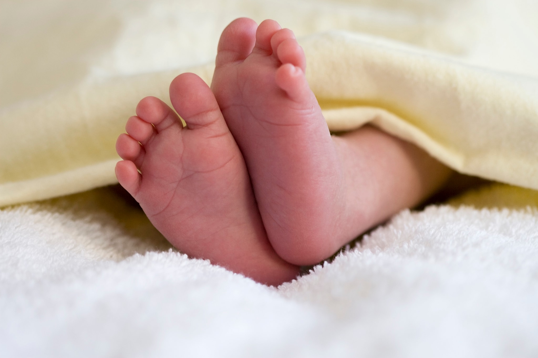 Baby feet on blanket