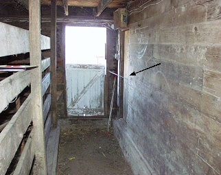 Photo #1. Looking south towards vet room door indicated by arrow.