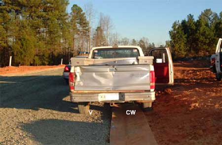 Approximate location of the victim and coworker at time of incident. Tailgate shows damage resulted when grader struck the truck.