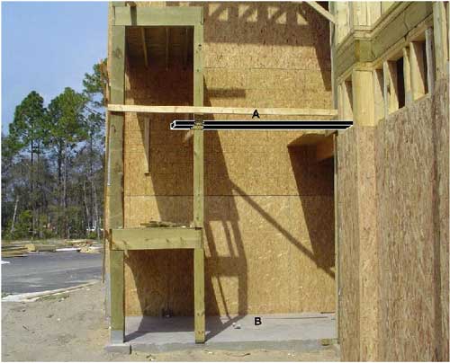 Close-up view of condominium stairwell and balcony. Shows approximate location of elevated work platform from which the victim fell.