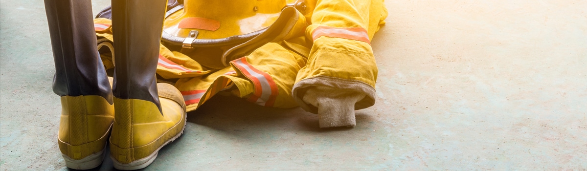 Firefighter uniform sits empty on the floor.