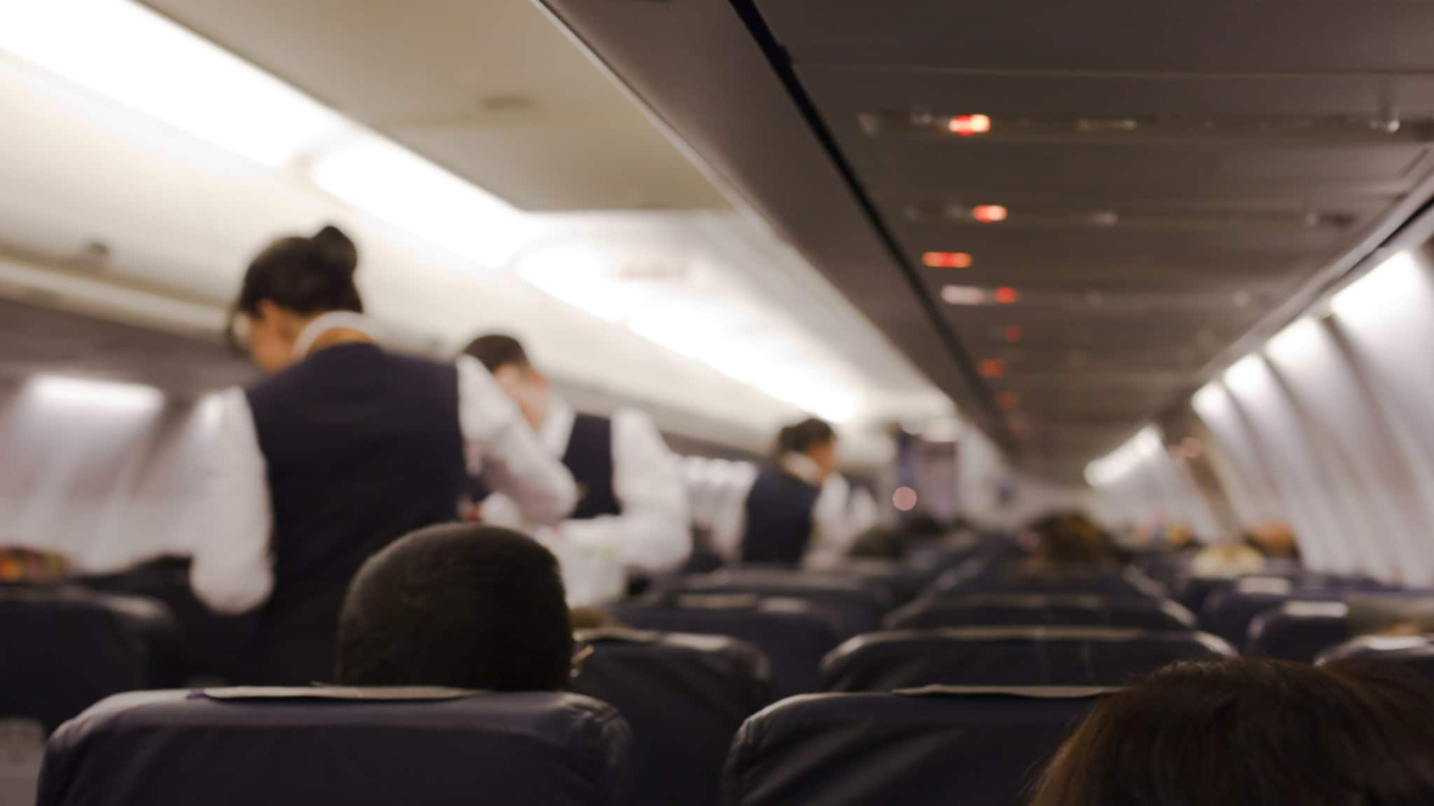 View from the rear of a airplane cabin interior