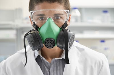 Lab worker wearing a respirator.