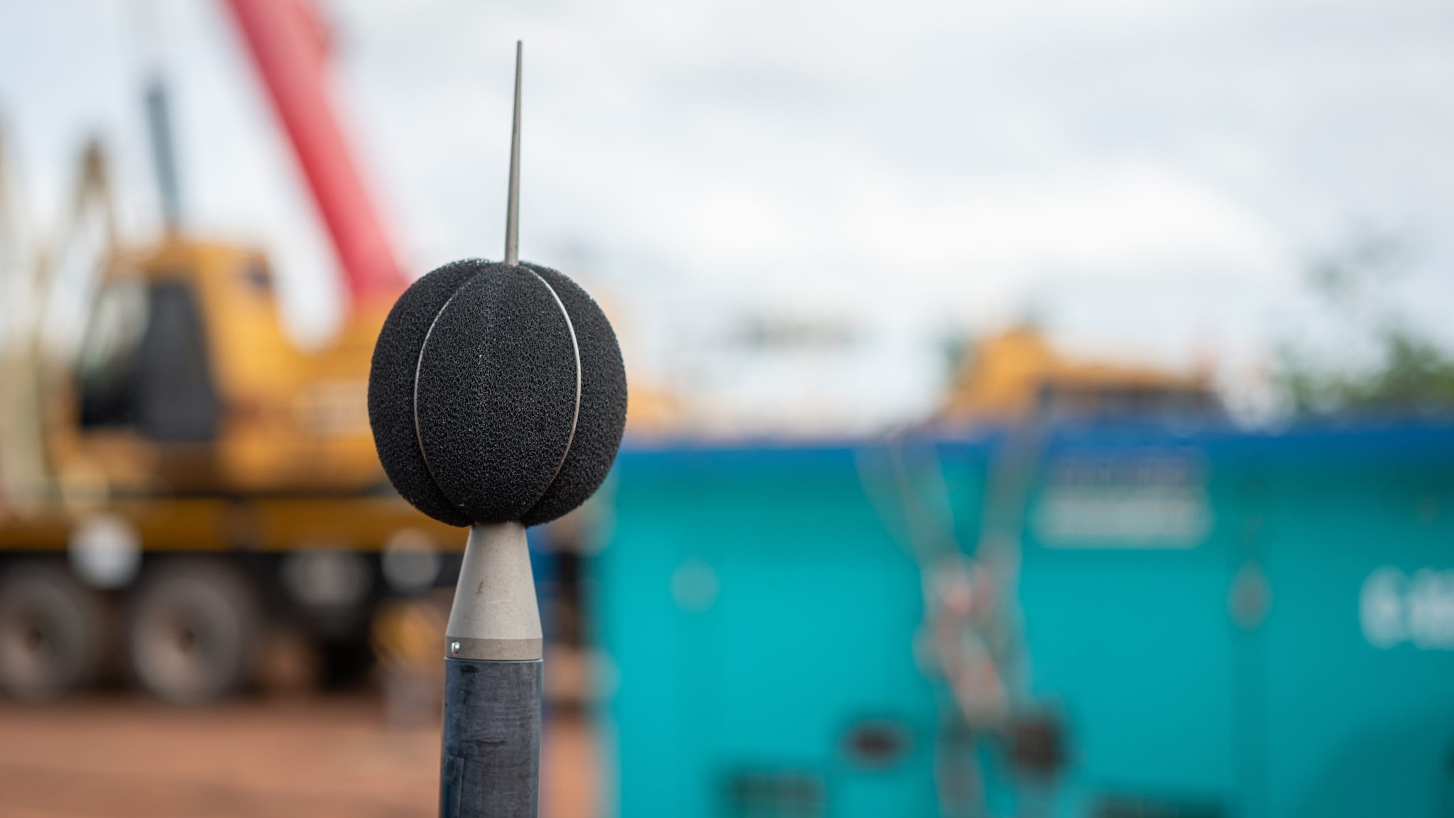 A sound recording equipment using to measuring noise level with blurred background of construction working place