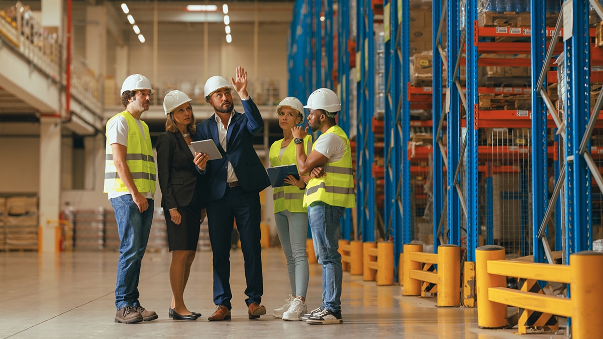 Diverse group of male and female workers on a construction site.