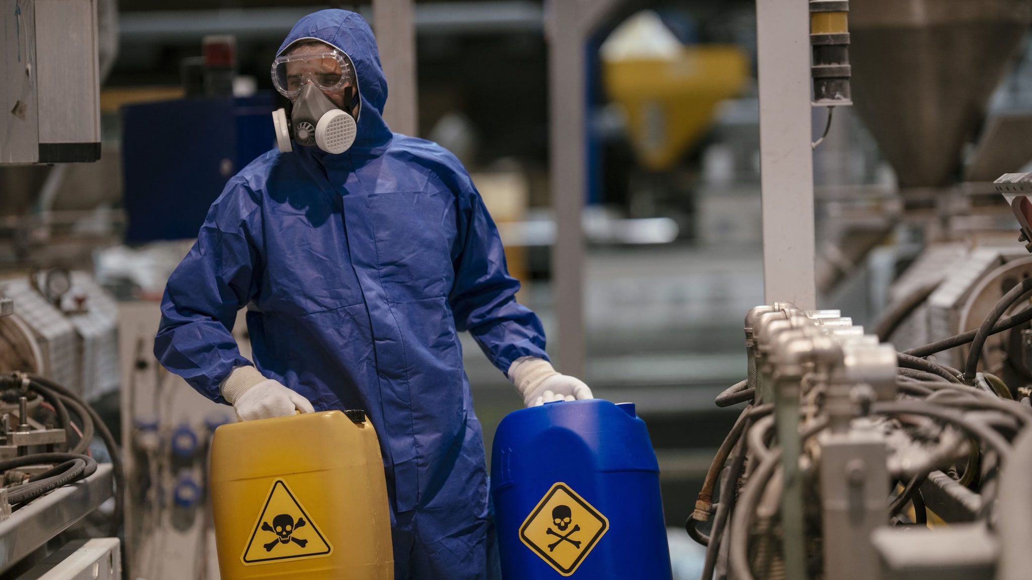 Factory worker working with dangerous materials.