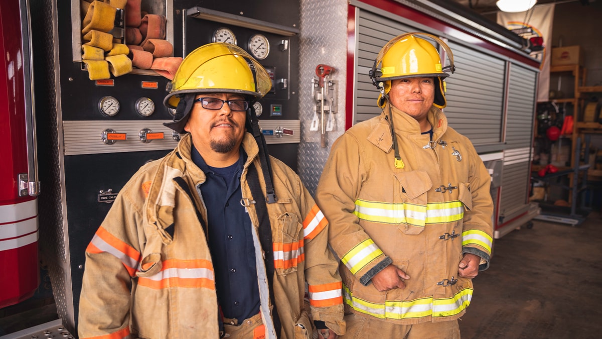 Two male firefighters on the Navajo Reservation, Utah. Image by Rich Vintage, Getty Images