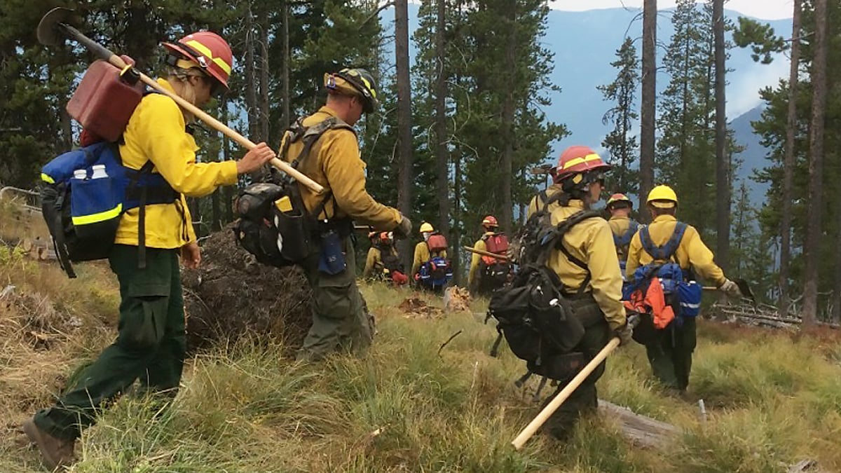 Hot shot crew moves down to fire site.