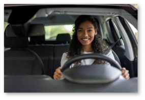 Woman behind the wheel of a car