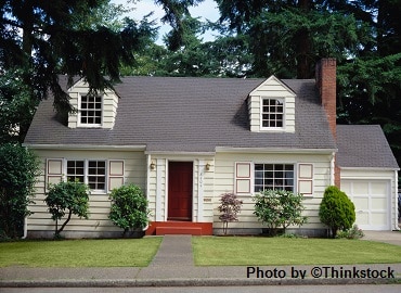 A two-story house with a red door