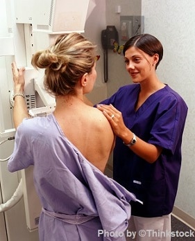 woman getting mammogram