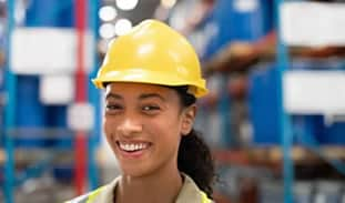 An employee in a hard hat.