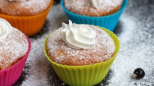 Frosted cupcakes sprinkled with sugar.