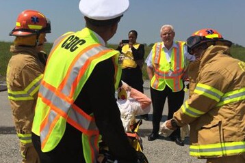 A CDC quarantine public health officer, and EMS responders to assess the health of the “survivor”.