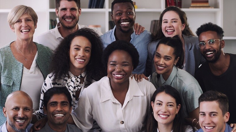 Group of community members smiling at camera