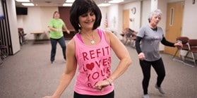 Group of women participating in a group fitness class.