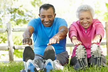 elderly couple stretching