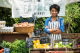 a woman surrounded by vegetables