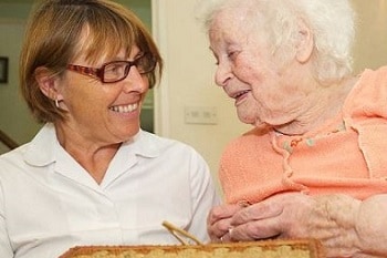 Two women holding hands