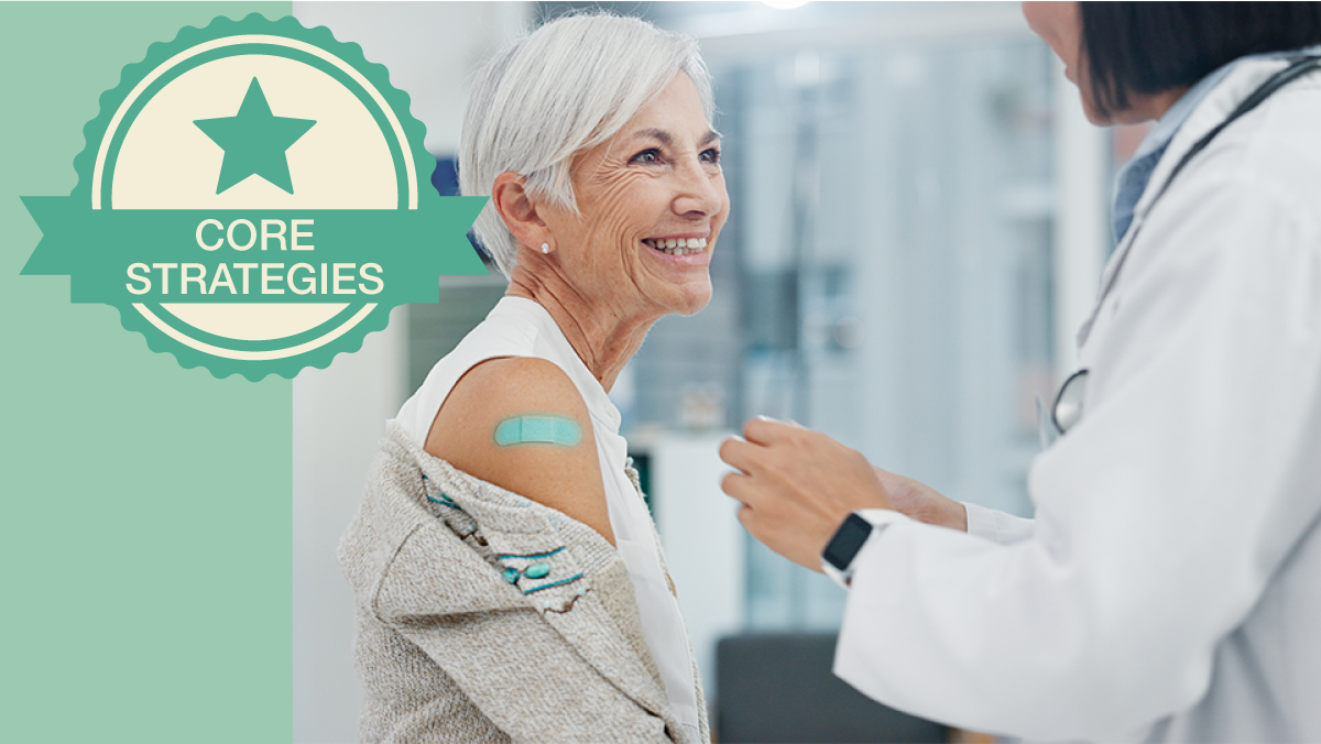 Older adult with a band aid on her arm after receiving vaccine from a healthcare provider.