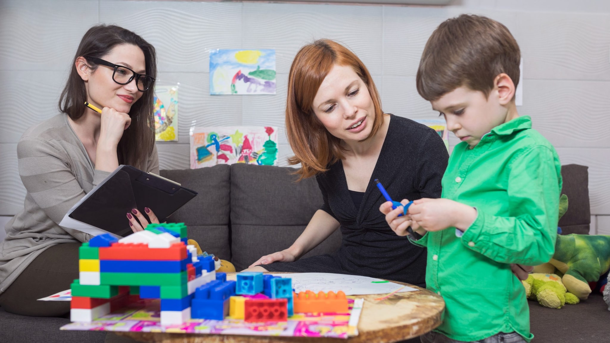 Child Psychologist at Work with a child and parent