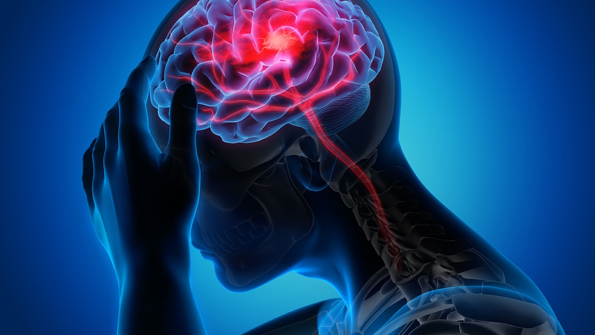 Illustration of a person holding their head with the brain highlighted