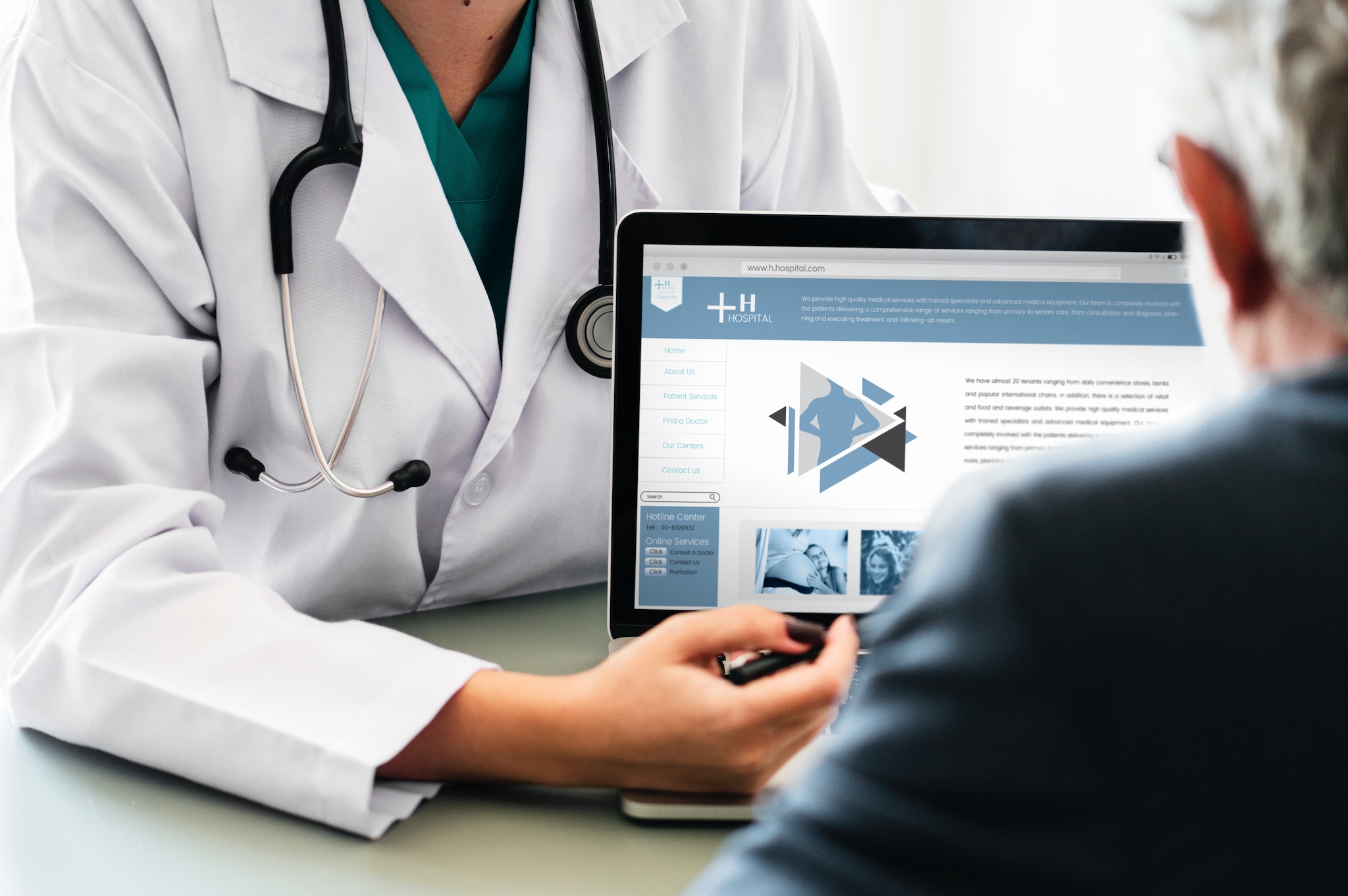 doctor showing patient health care information on a tablet