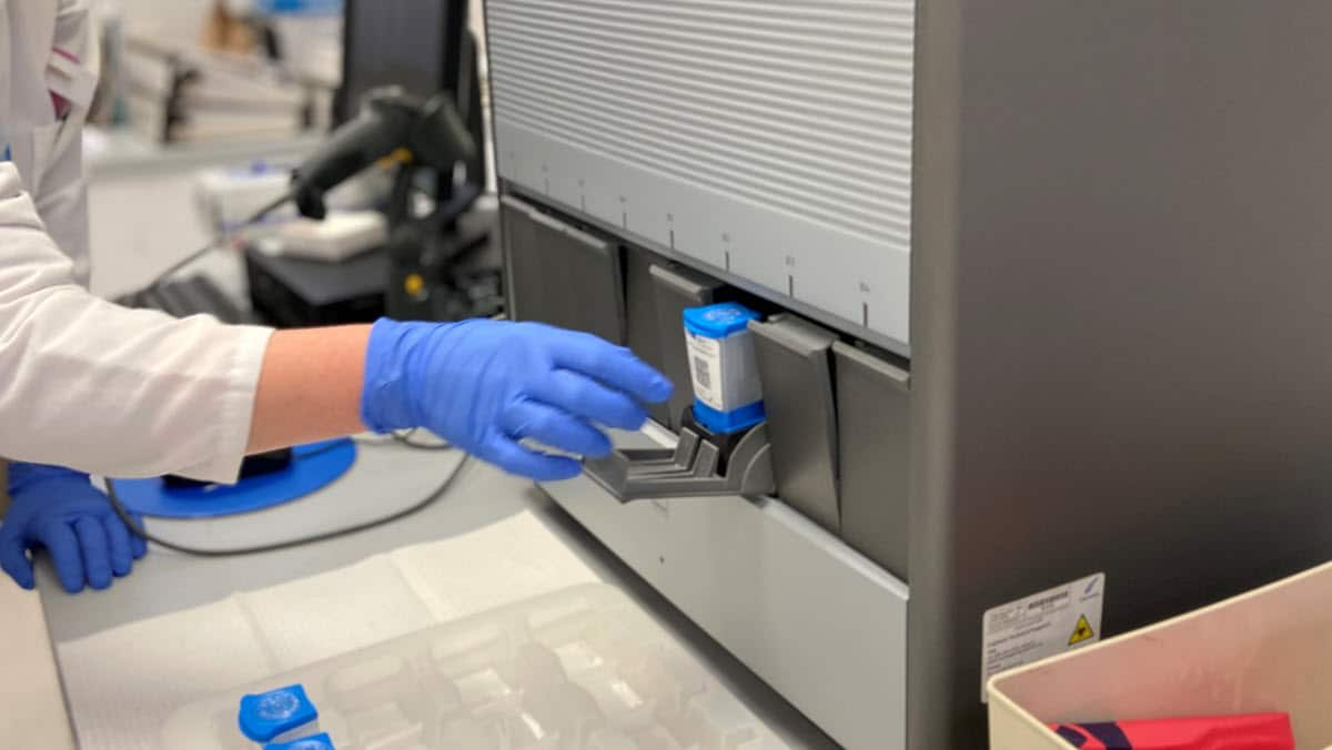 A laboratorian performs a Xpert MTB/RIF Assay