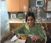 Jackie, a tuberculosis survivor, having lunch in the hospital