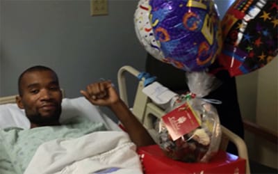 Shaka, a tuberculosis survivor, in a hospital stretcher