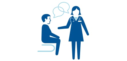 A male patient figure is sitting down while he and a female provider our having a conversation about TB.