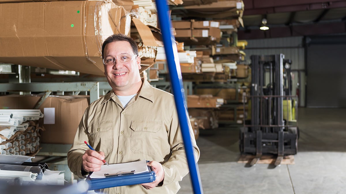 Man working in a large warehouse.