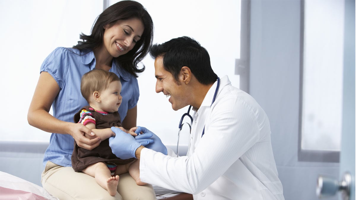 Women with infant and doctor