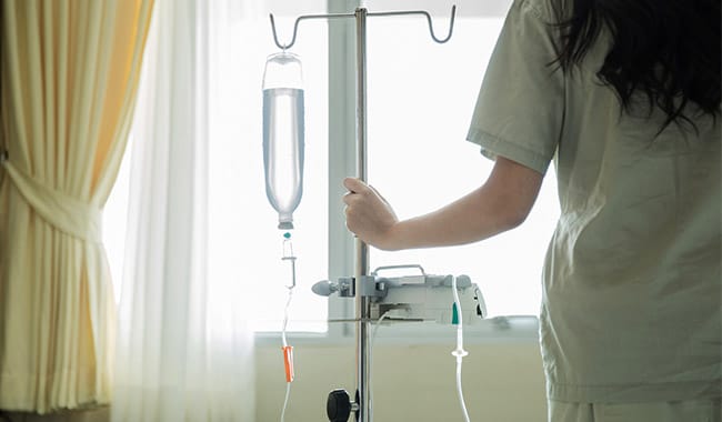 Nurse with a chemotherapy IV .