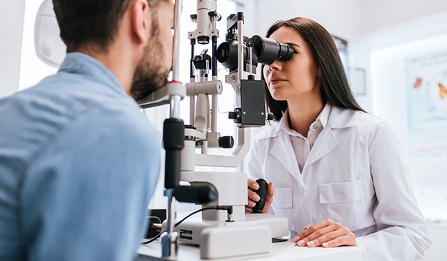 Doctor and patient in ophthalmology clinic.