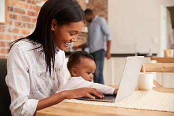 Mom with laptop and baby