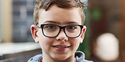 Cropped shot of an elementary school boy in the corridor at school