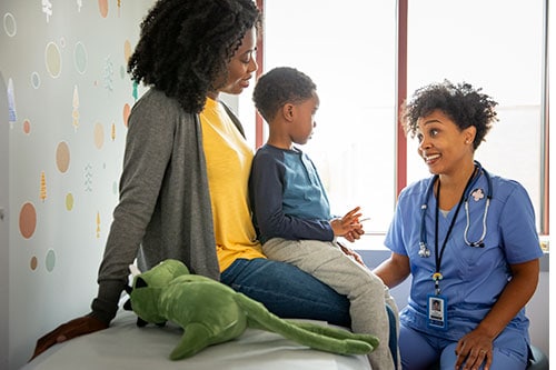 Mother and son talking with a healthcare professional