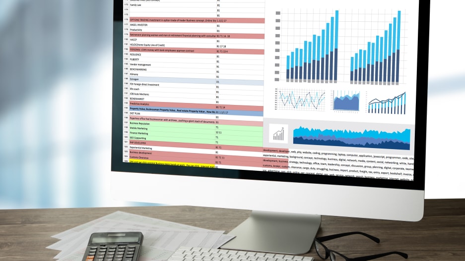 Computer with spreadsheet on screen