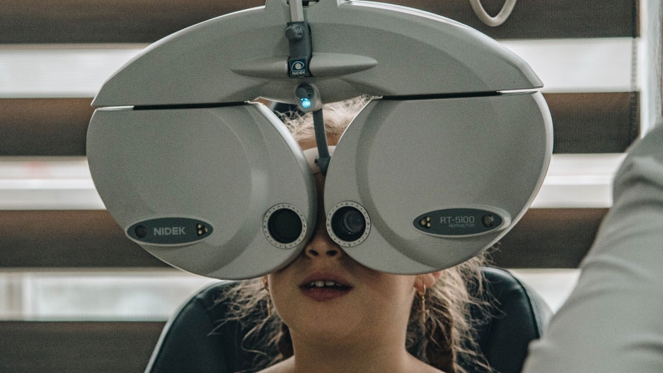 young patient getting eye exam