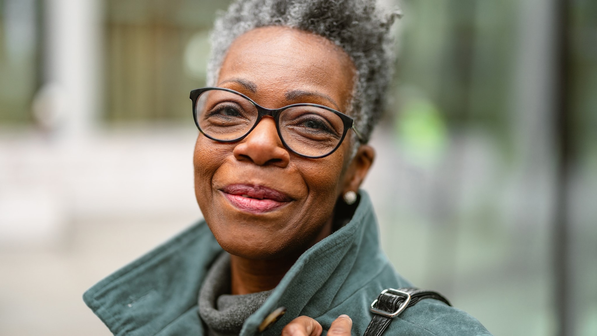 Older smiling woman with glasses