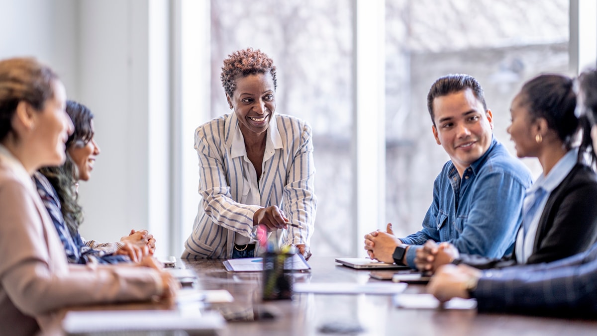 Group of professionals in office meeting.