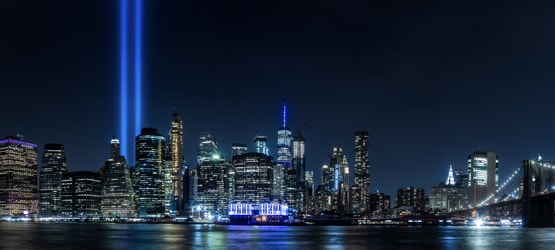 New York City Skyline with American Flag overlay.