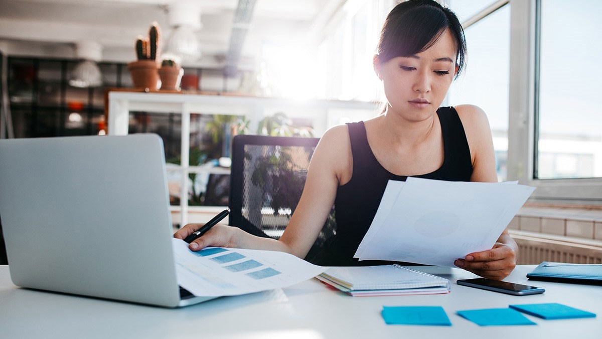 A female data researcher looking at the printout results